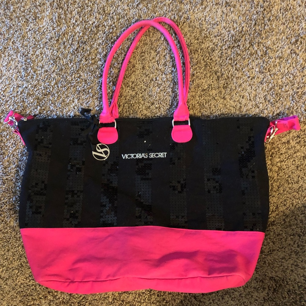 VS pink and black overnight bag.